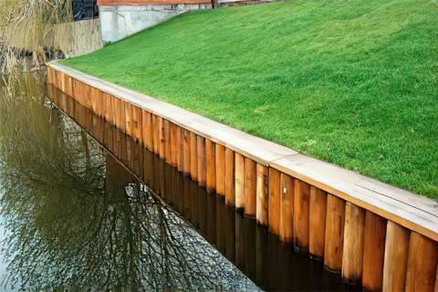 wooden pole bulkhead retaining wall