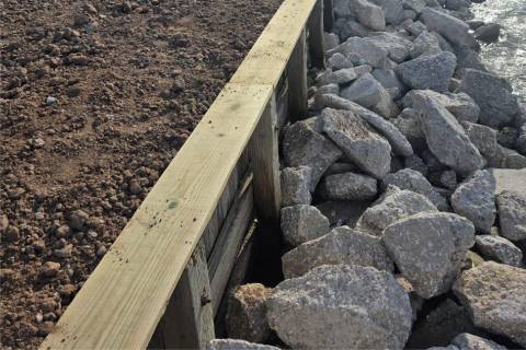 wooden bulkhead with riprap shoreline protection
