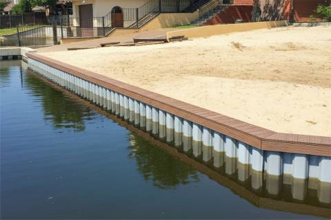 vinyl bulkhead with composite decking and beach