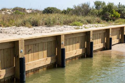 wooden bulkhead with piling guards protection