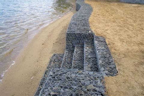 gabion seawall with stairs on beach