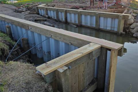 shoreline stabilization bulkhead construction vinyl sheet piling waterfront maintenance tie rod system