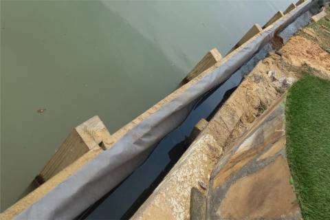 shoreline maintenance wooden bulkhead piling repair waterfront construction