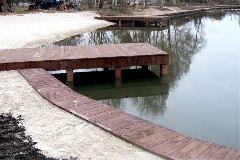 wooden boardwalk pier curved