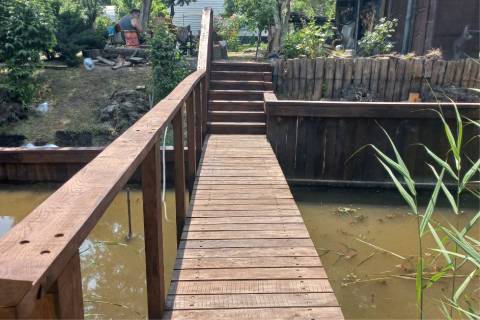 wooden bridge walkway stairs retaining wall