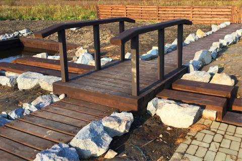 wooden bridge garden path landscape stones
