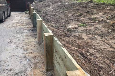 wooden retaining wall driveway